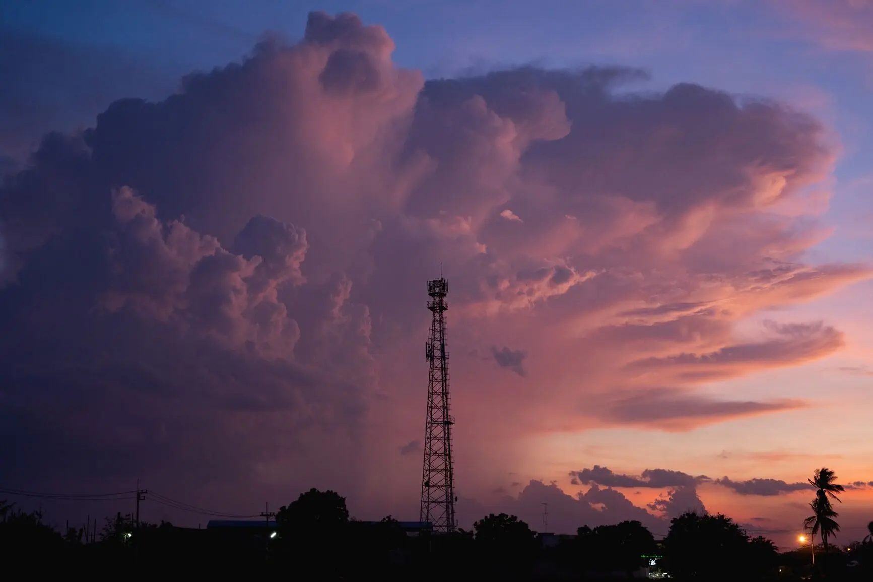 A cell tower against an evening sky
